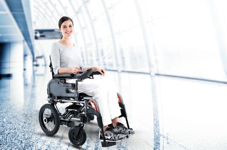 a-woman-in-a-power-wheelchair-at-the-airport