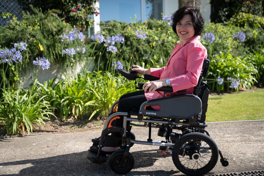 woman-in-a-power-wheelchair-going-around-the-garden