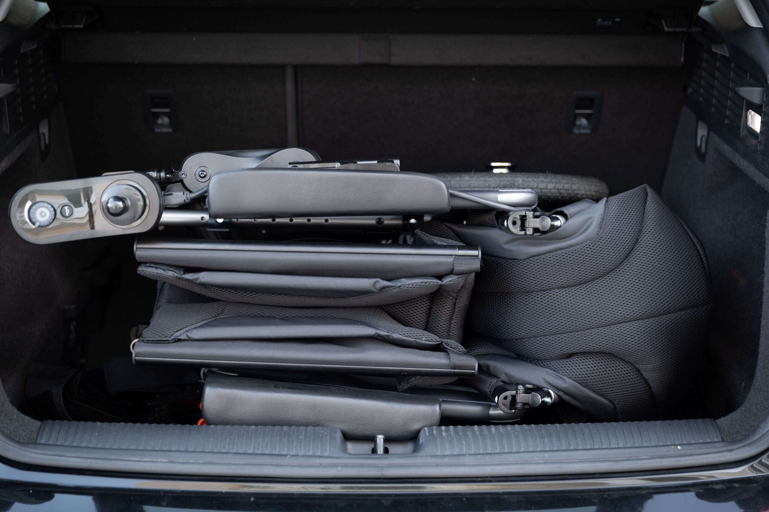 The-power-wheelchair-is-folded-and-put-in-the-car-trunk 